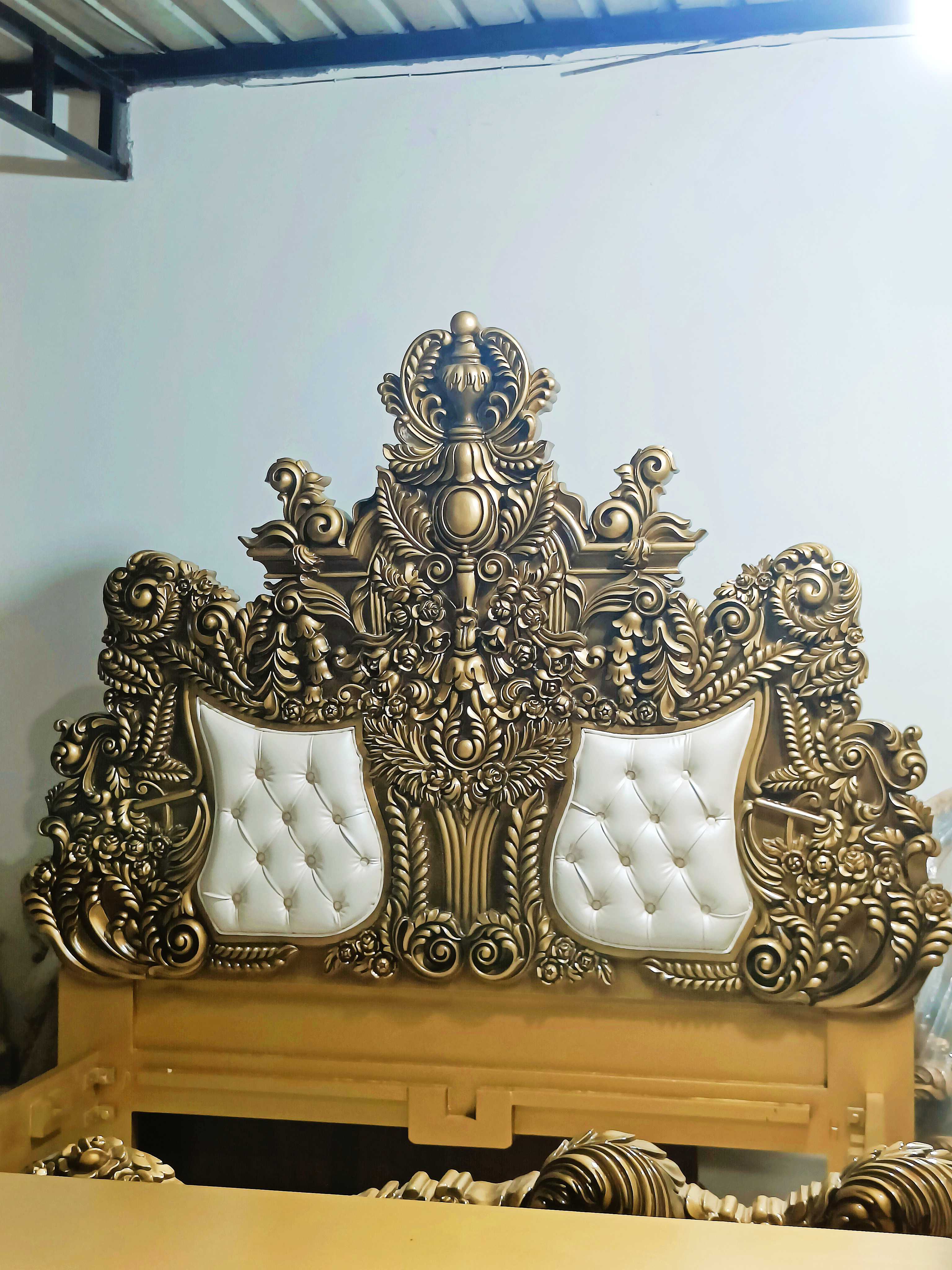 Royal bed Handcrafted maharaja Design made of premium Quality teak Wood - Baroque Style Carving with metallic Gold color and White Tufted Leather - Carved in India Brand Royalzig Luxury Furniture 