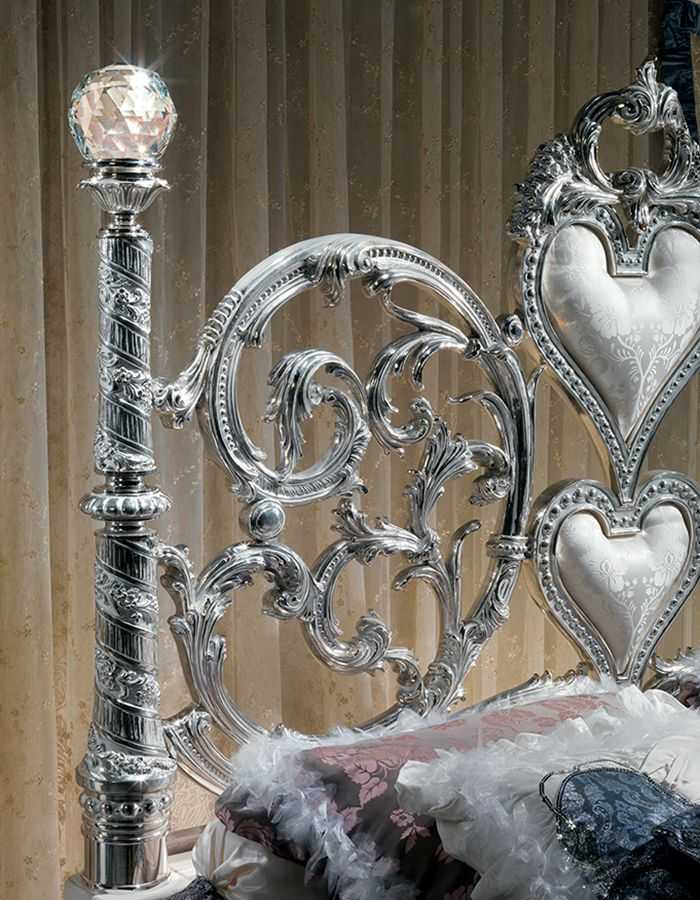 Grand Luxury Silver Bedroom Set with Scroll Work Heart Headboard, Crystal Top Posts, Ornamental Side Tables And Decorative Baroque Mirror