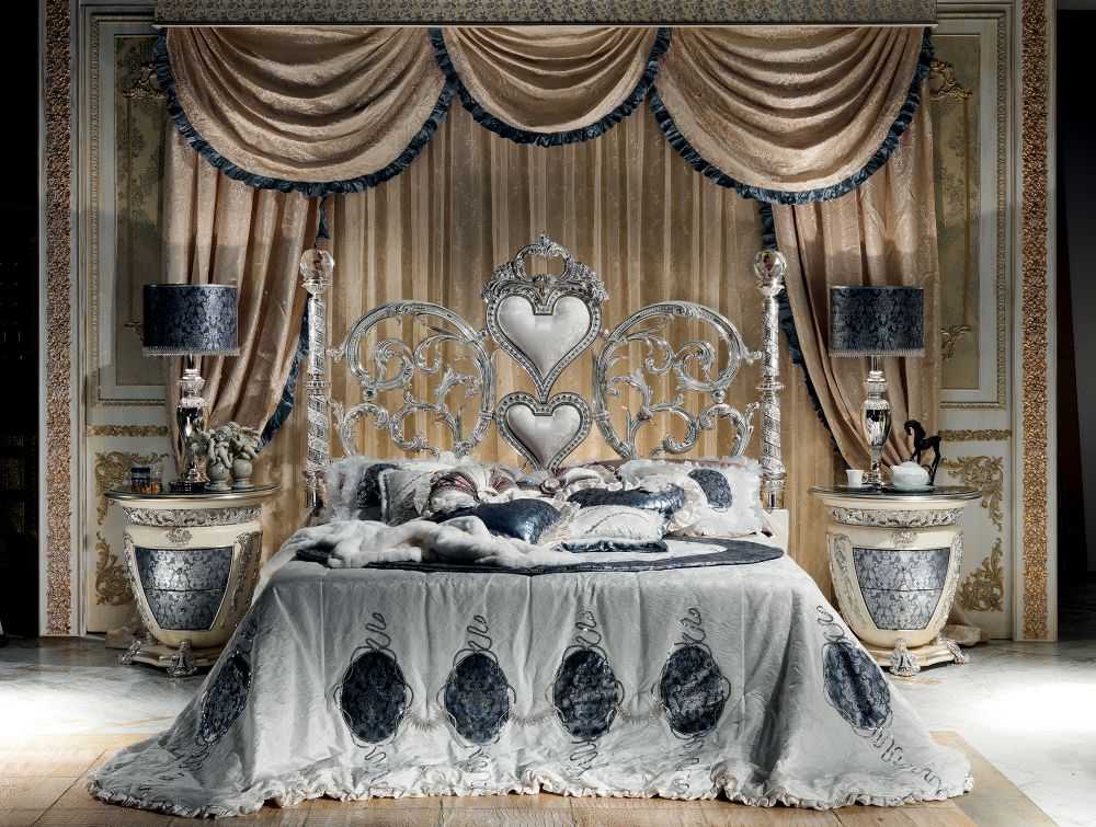 Grand Luxury Silver Bedroom Set with Scroll Work Heart Headboard, Crystal Top Posts, Ornamental Side Tables And Decorative Baroque Mirror