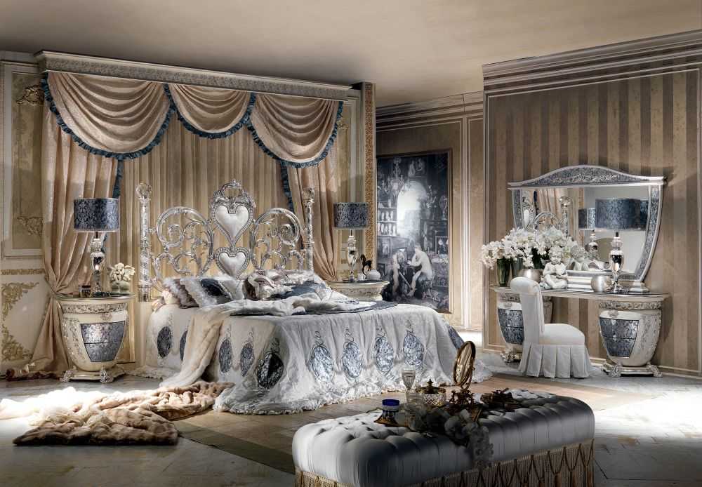 Grand Luxury Silver Bedroom Set with Scroll Work Heart Headboard, Crystal Top Posts, Ornamental Side Tables And Decorative Baroque Mirror